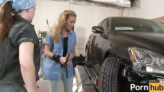 The lesbians have fun with a new girl in the garage in a steamy scene