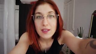 Redhead Trish Collins tries on sexy lingerie and gets horny, damn!