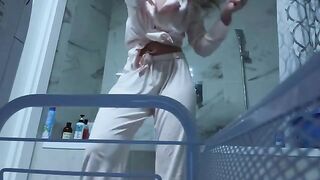A cute girl masturbating her sweet pussy in the bathroom alone