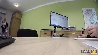 A business lady is trying to get a bank loan for her company