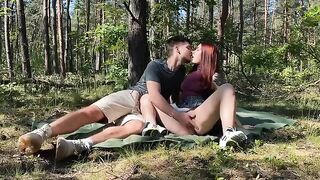Passionate amateur couple have sex on a picnic in the park