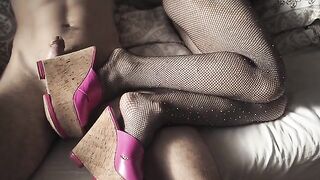 A hot girl in fishnet stockings and high heels is ready to please