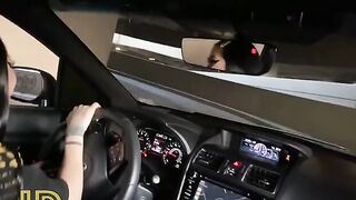 Slutty chick wanking cock in the car parking lot