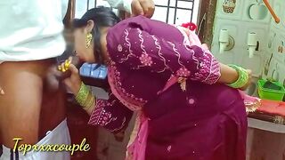 A maid is having fun with the master of the house in the kitchen