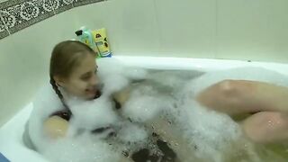 A young girl fucks with her friend's wife in the kitchen