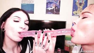 Two hot lesbian babes fuck each other with a double-ended dildo, showcasing their juicy pussies in action