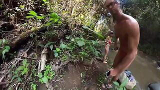 A couple is fucking in the river, deep in the jungle