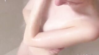 We shower, massage each other, and have sex over the couch in an intimate homemade scene