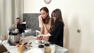 Two stunning women, cooking syrniki, their voices filled with passion, becoming increasingly seductive