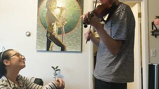 The guy tried to practice violin but was interrupted by his passionate girlfriend