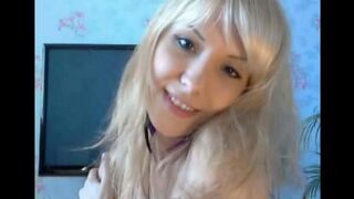 Blondie caresses her pussy with her fingers