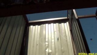 A girl has sex on the beach in a secluded cabin, unaware of being watched