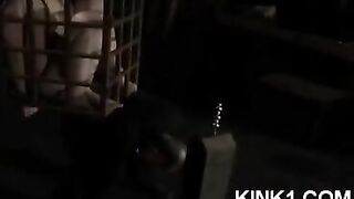 A slave in a cage is at the mercy of his master's desires