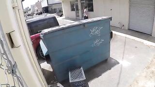 The girl was photographed naked behind the garbage tank