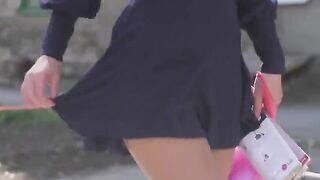 A very beautiful girl appears on camera wearing only red stockings
