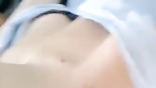 A half-naked girl tells a lie and caresses her body with her hands
