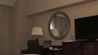 A man checks into a hotel and undresses a whore
