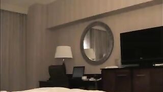 A man checks into a hotel and undresses a whore