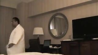 A man checks into a hotel and undresses a whore