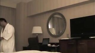 A man checks into a hotel and undresses a whore