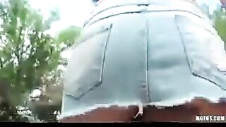 A hot brunette girl masturbating on the city streets