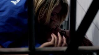 Two hot chicks are licking each other in a prison cell