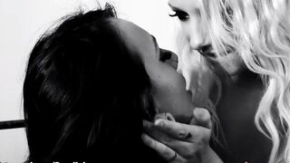 Two lesbians are having fun with dildo on the bed