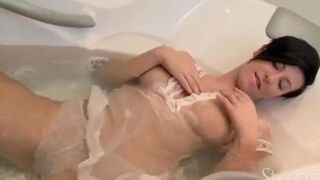 A lonely pregnant brunette masturbates on the couch with intense desire