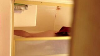 A girl has sex in the shower and is filmed without her knowledge