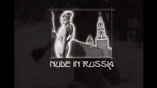 Nude girls have fun with snowballs on the street in winter