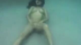 Underwater sex with a busty brunette beauty in the ocean full of passion