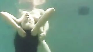 Underwater sex with a busty brunette beauty in the ocean full of passion