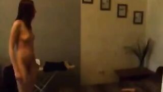 A young Russian beauty playing with herself in the kitchen