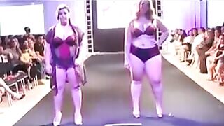 Some fat girls are running on the boardwalk in front of the camera