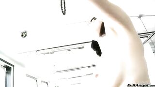 A cute girl wearing sexy high heels plays with sex balls