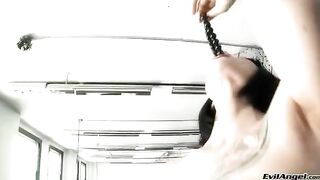 A cute girl wearing sexy high heels plays with sex balls