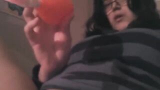 The girl plays with her vibrator and achieves a clitoral orgasm
