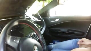 The pretty girl was playing on her phone in the car