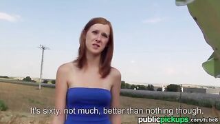 A red-haired girl is fucking on the hay in the open countryside