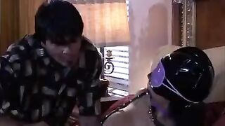 A girl is playing a BDSM game with an adult mistress