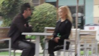 A blond girl is having fun directly in the car, showcasing her skills
