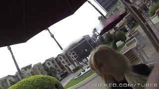 A blond girl is having fun directly in the car, showcasing her skills