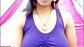 The nipples of an excited brunette push through her T-shirt