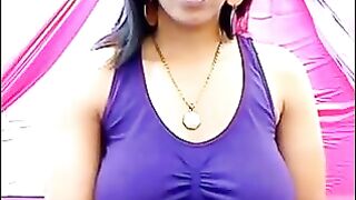 The nipples of an excited brunette push through her T-shirt