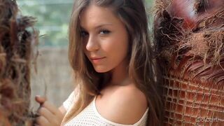 A beautiful Russian girl named Katerina is stripping slowly