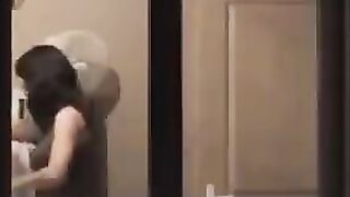 He admires himself in the mirror standing in front of him completely naked
