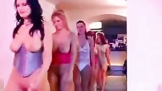 A big-breasted girl is having fun with many boys on the couch