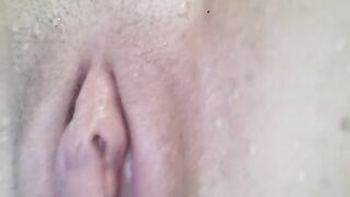 A girl has an orgasm under the water and a close-up of her pussy