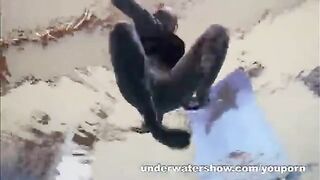 A hot naked girl is having fun in the swimming pool