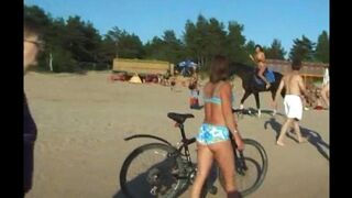Nude beauties have fun on the beach without any clothes